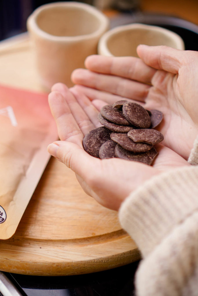 Ora Cacao Thriving Tanzania discs in hands