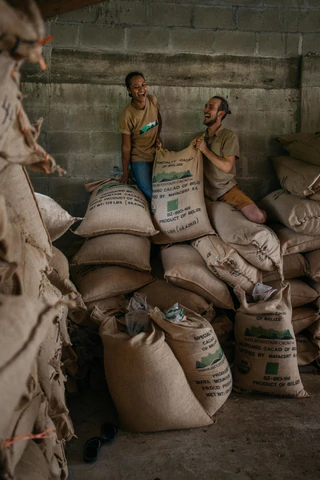 Jonas lifting beans sack