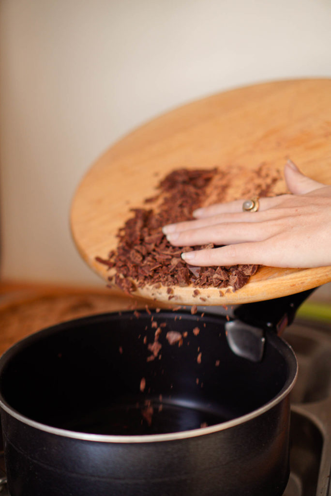 Vai Cacao Qeqchi throwing cacao in a pan