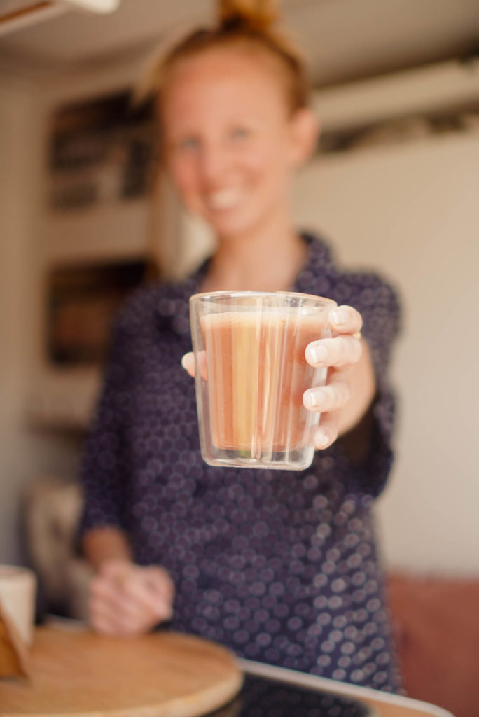 Vai Cacao Qeqchi Romane handing a cup